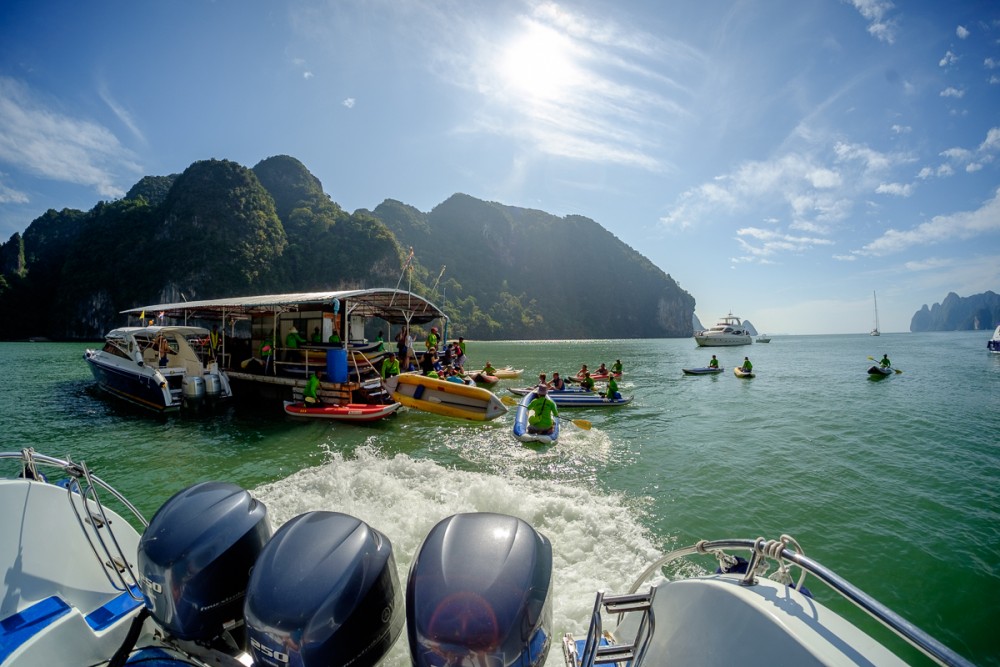 Speedboat engines and limestone islands in Thailand seen through the fisheye