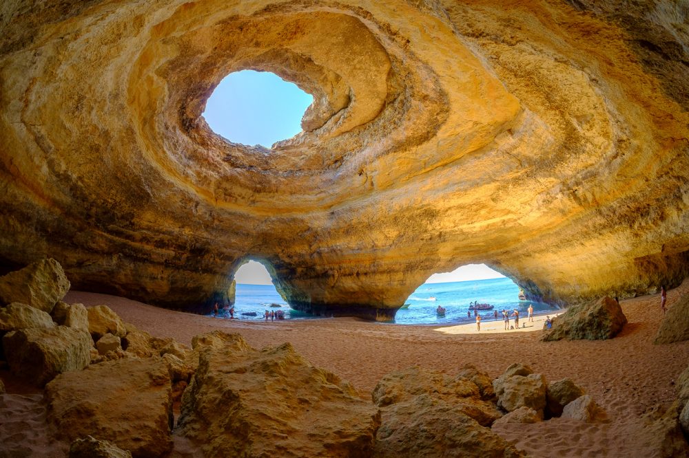 Wide view of the Benagil Sea Cave interior with its domed roof and openings to the sea